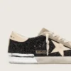 Super-Star in glitter nero con stella color crema e inserti in pelle scamosciata