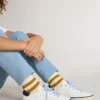 Super-Star Junior in pelle bianca con linguetta sul tallone in pelle scamosciata blu
