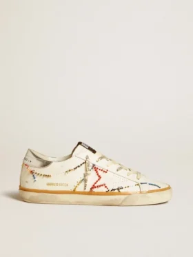 Super-Star LTD da donna con stella traforata e linguetta sul tallone in pelle metallizzata