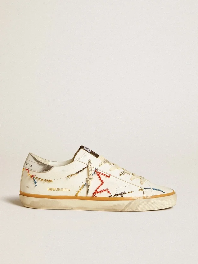 Super-Star LTD da donna con stella traforata e linguetta sul tallone in pelle metallizzata