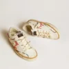 Super-Star LTD da donna con stella traforata e linguetta sul tallone in pelle metallizzata