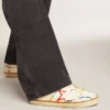 Super-Star LTD da donna con stella traforata e linguetta sul tallone in pelle metallizzata