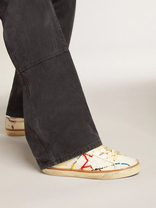 Super-Star LTD da donna con stella traforata e linguetta sul tallone in pelle metallizzata