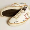 Super-Star LTD da donna con stella traforata e linguetta sul tallone in pelle metallizzata