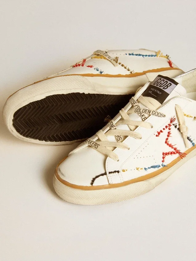 Super-Star LTD da donna con stella traforata e linguetta sul tallone in pelle metallizzata