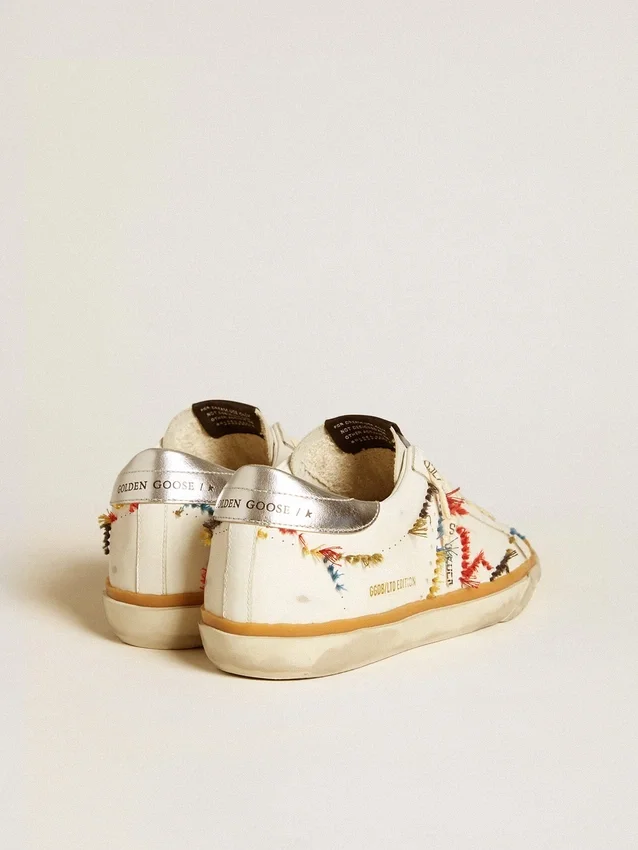 Super-Star LTD da donna con stella traforata e linguetta sul tallone in pelle metallizzata