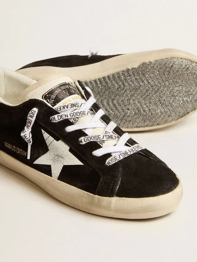 Super-Star LTD da donna in pelle scamosciata nera con stella stampata bianca e linguetta sul tallone con glitter argento
