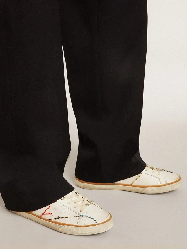 Super-Star LTD da uomo con stella traforata e linguetta sul tallone in pelle metallizzata