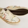 Super-Star LTD da uomo con stella traforata e linguetta sul tallone in pelle metallizzata
