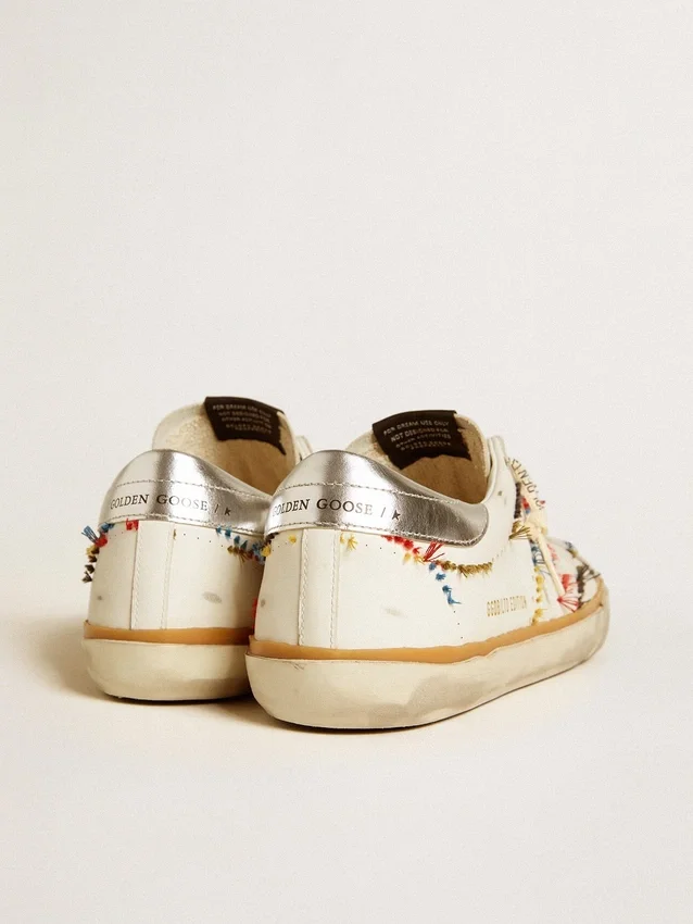 Super-Star LTD da uomo con stella traforata e linguetta sul tallone in pelle metallizzata