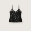Top da donna in tulle nero con motivo floreale in paillettes nere