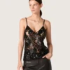 Top da donna in tulle nero con motivo floreale in paillettes nere