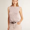 Top in maglia a rete con paillettes e dettagli a contrasto