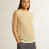 Top in maglia a rete con paillettes e dettagli a contrasto
