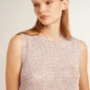 Top in maglia a rete con paillettes e dettagli a contrasto