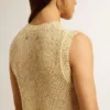Top in maglia a rete con paillettes e dettagli a contrasto