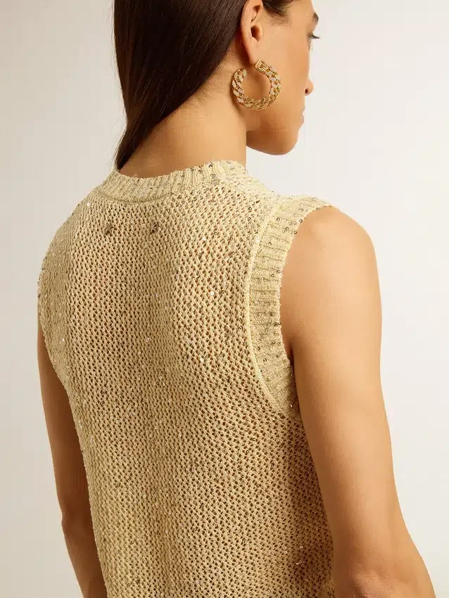 Top in maglia a rete con paillettes e dettagli a contrasto