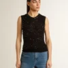 Top in maglia a rete nera con paillettes e dettagli a contrasto