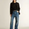 Top in maglia a rete nera con paillettes e dettagli a contrasto