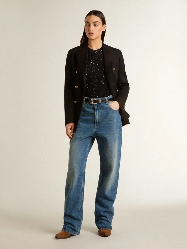 Top in maglia a rete nera con paillettes e dettagli a contrasto