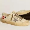V-Star in nappa color ecru con stella in nappa argentata e ricamo con perline
